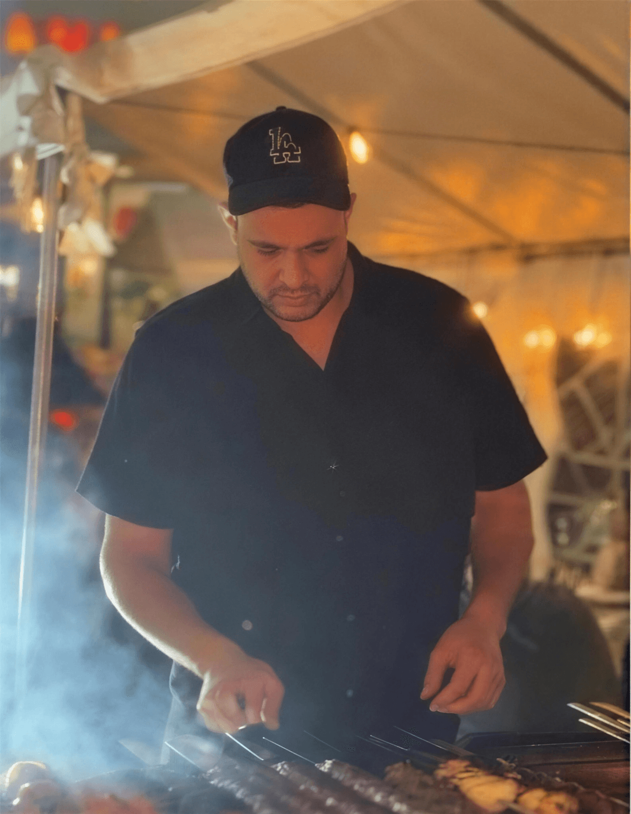Benny Azizi at the charcoal grill